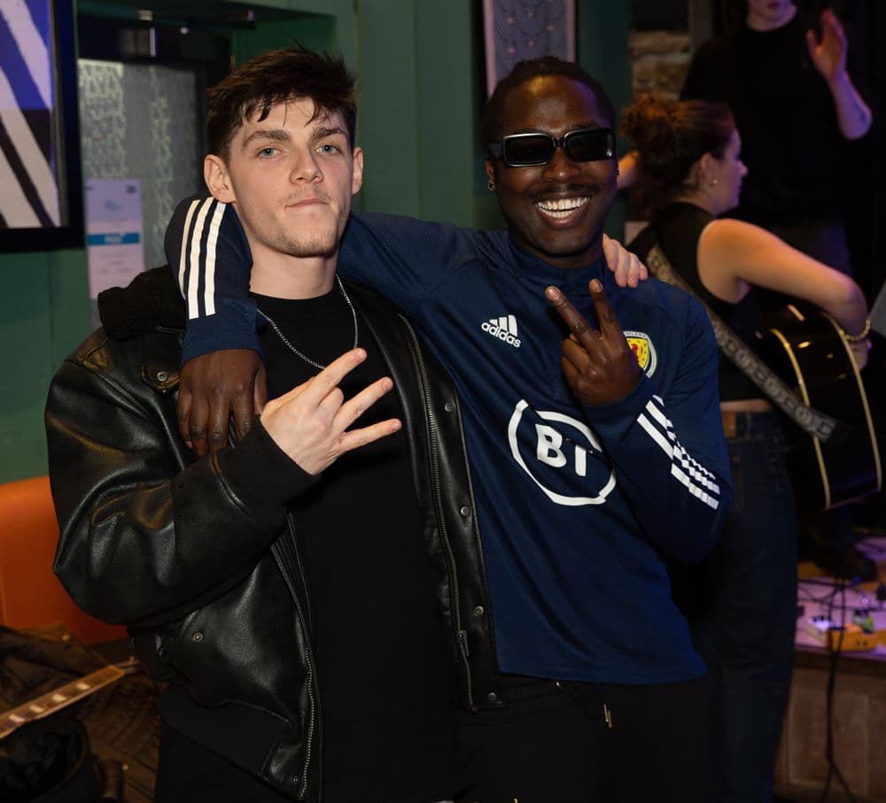 Two friends posing for the camera at a STACC night